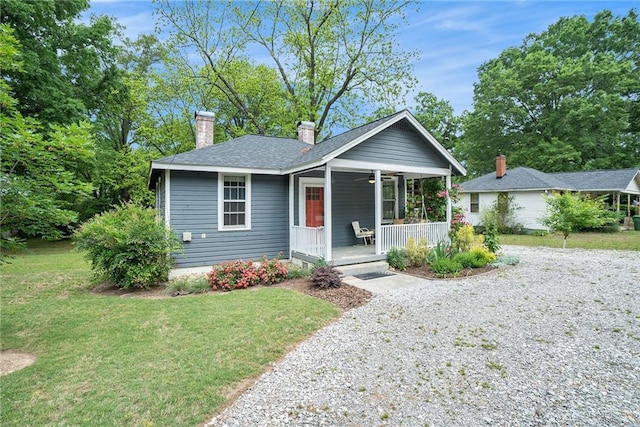 121 Norris St, Monroe, GA 30655 - living room featuring crown molding, a fireplace, baseboards, and wood finished floors