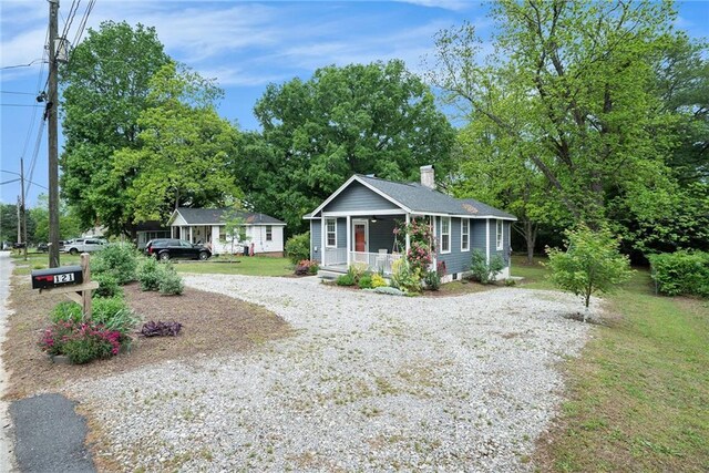 121 Norris St, Monroe, GA 30655 - view of yard with a shed, fence, and an outdoor structure