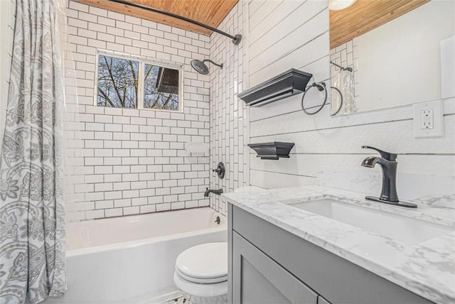 bathroom featuring toilet, wooden ceiling, shower / bathtub combination with curtain, vanity, and wood walls