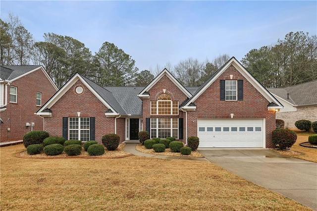 front of property featuring a garage and a front yard