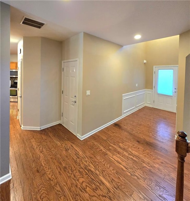 spare room with hardwood / wood-style floors