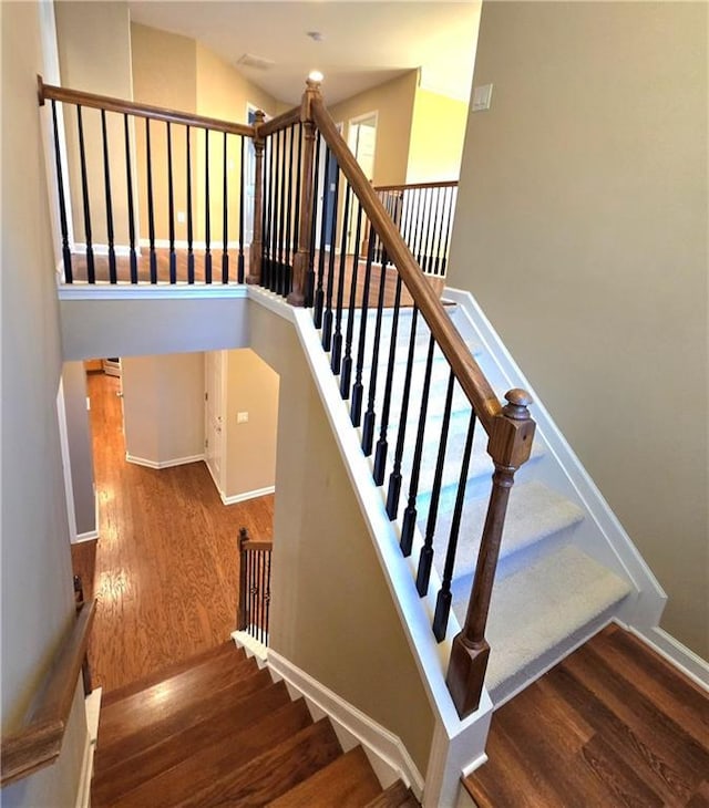 stairway with wood-type flooring