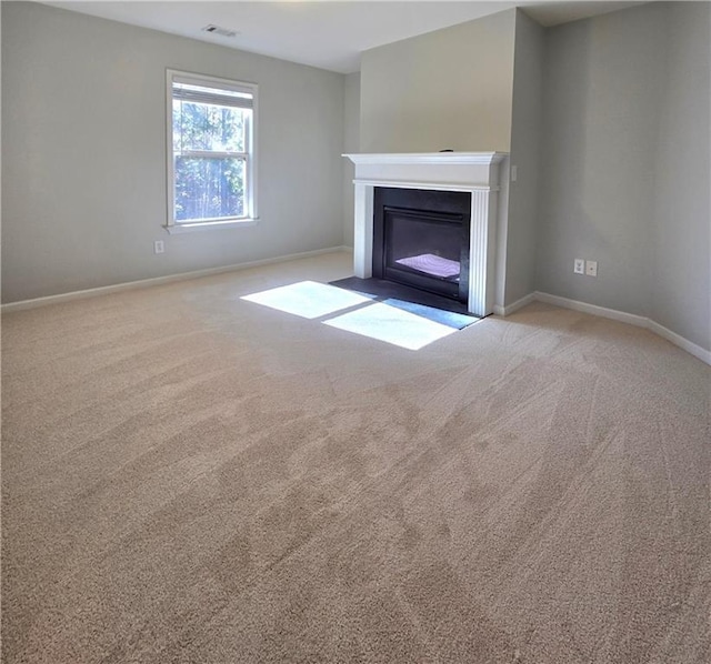 unfurnished living room with light carpet