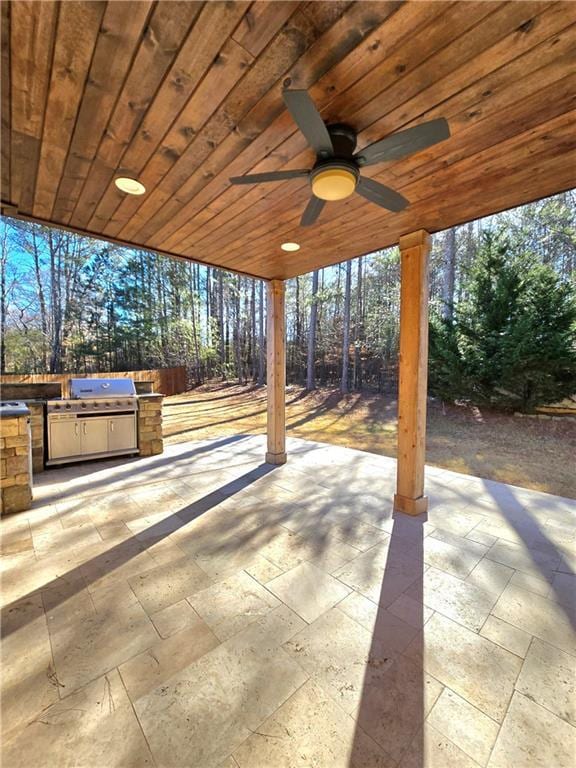 view of patio / terrace with ceiling fan and area for grilling