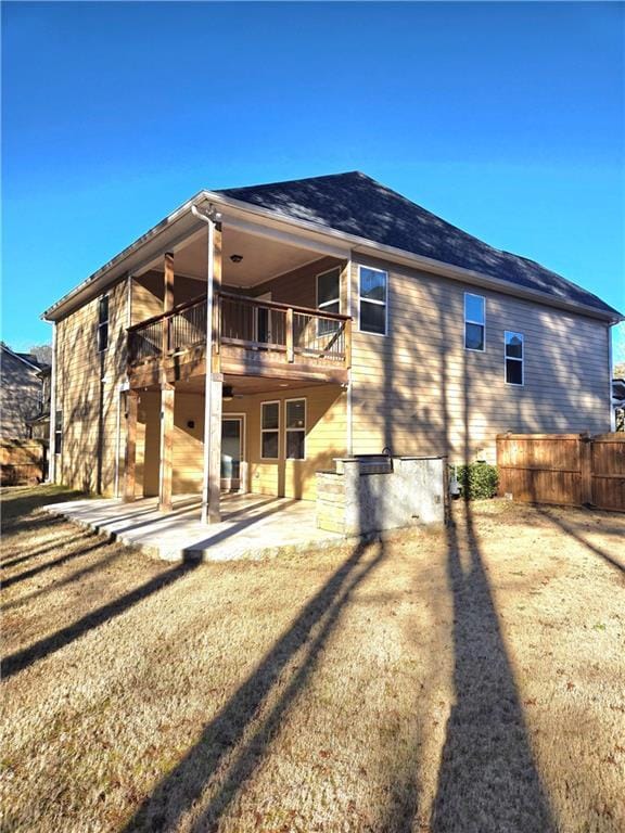 back of house featuring a yard and a patio