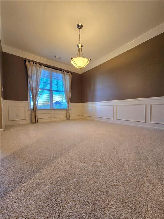 spare room featuring ornamental molding