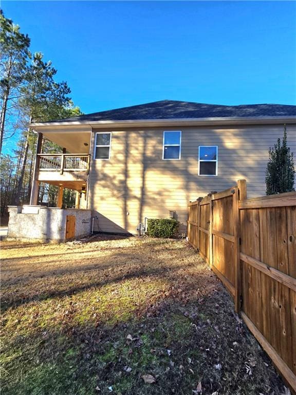 back of house with a balcony