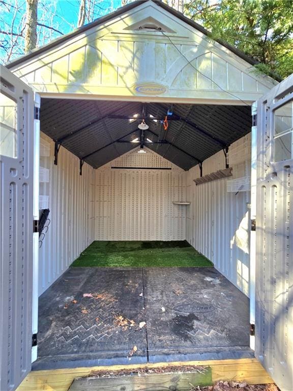 view of parking / parking lot featuring a carport