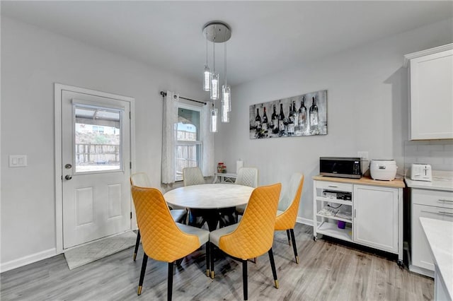 5452 Fountainhead Ln, Auburn, GA 30011 - dining space featuring light wood-style floors and baseboards