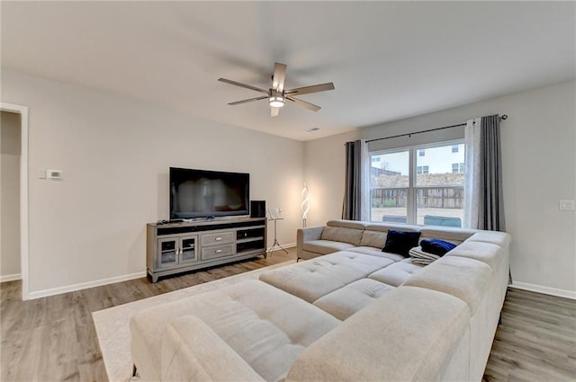 5452 Fountainhead Ln, Auburn, GA 30011 - living area featuring ceiling fan, baseboards, and wood finished floors