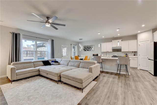 5452 Fountainhead Ln, Auburn, GA 30011 - living area featuring recessed lighting, a ceiling fan, light wood finished floors, and baseboards