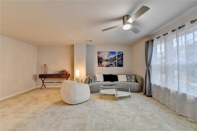 5452 Fountainhead Ln, Auburn, GA 30011 - carpeted living area with visible vents, a ceiling fan, and baseboards