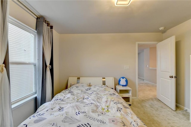 5452 Fountainhead Ln, Auburn, GA 30011 - bedroom featuring baseboards and light carpet