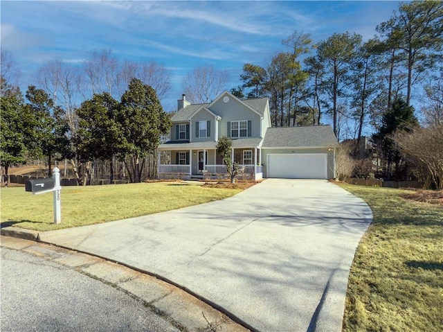 view of front of house featuring covered porch, a garage, and a front yard