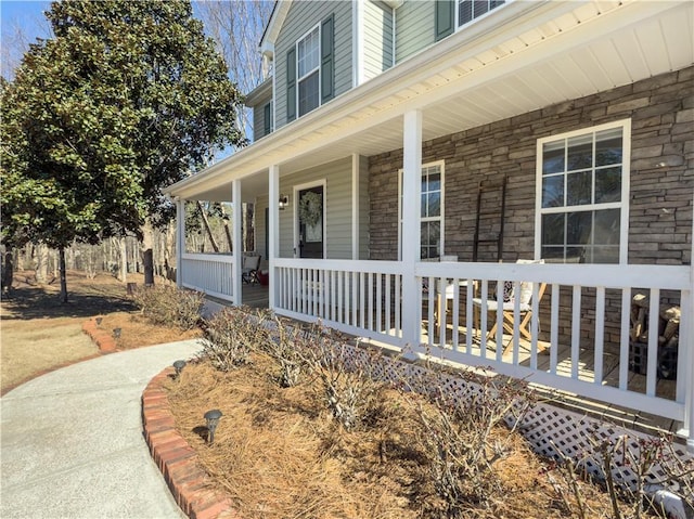 property entrance featuring covered porch