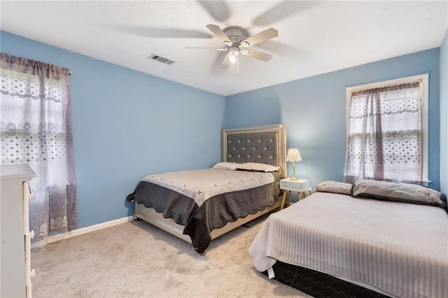 1433 Janice Ct SW, Lilburn, GA 30047 - carpeted bedroom with ceiling fan and baseboards
