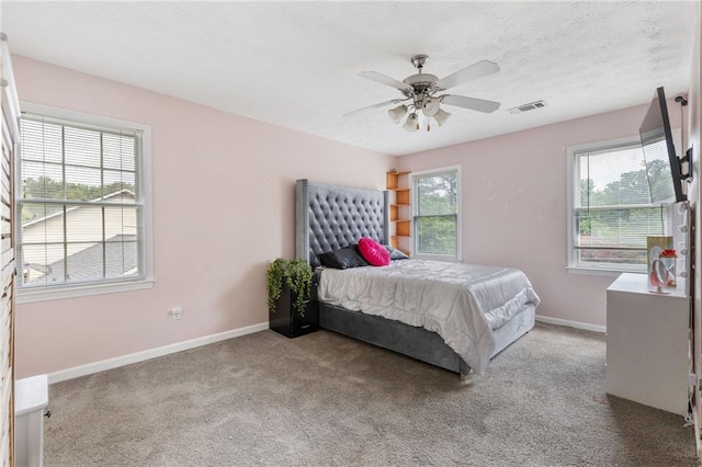 1433 Janice Ct SW, Lilburn, GA 30047 - carpeted bedroom featuring baseboards and a ceiling fan