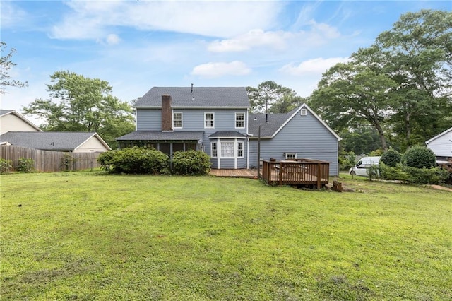 1433 Janice Ct SW, Lilburn, GA 30047 - back of property with a deck and roof with shingles