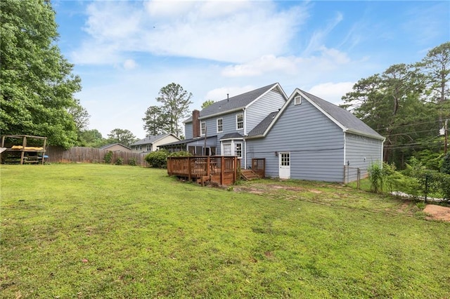 1433 Janice Ct SW, Lilburn, GA 30047 - back of house featuring a wooden deck