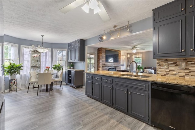 1433 Janice Ct SW, Lilburn, GA 30047 - kitchen with black dishwasher, ceiling fan, a textured ceiling, backsplash, and a peninsula