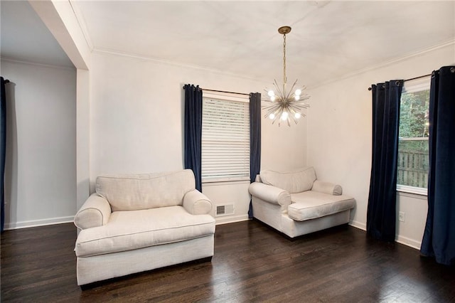 sitting room featuring crown molding, a notable chandelier, visible vents, wood finished floors, and baseboards