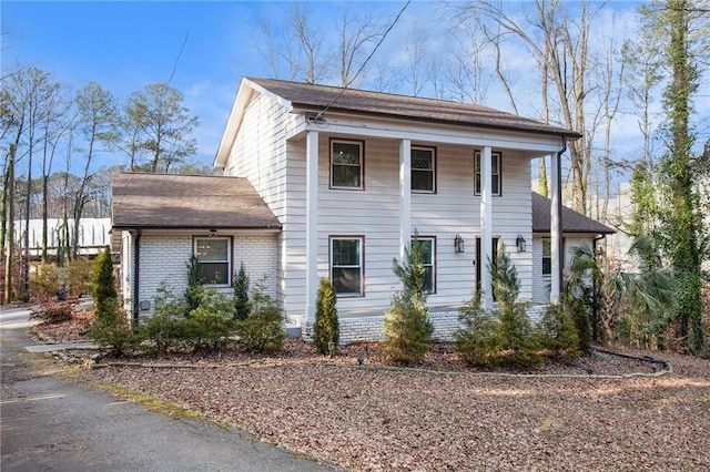 view of front of home with brick siding