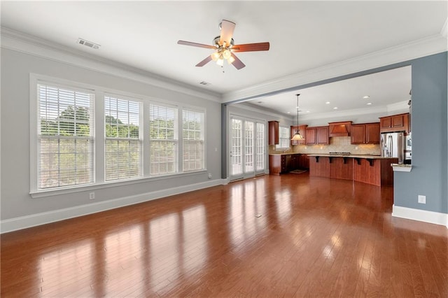 4677 Prater Way SE, Smyrna, GA 30080 - unfurnished living room with baseboards, ceiling fan, dark wood-type flooring, and ornamental molding