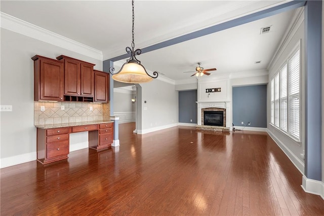 4677 Prater Way SE, Smyrna, GA 30080 - kitchen featuring a ceiling fan, dark wood-style floors, decorative backsplash, ornamental molding, and decorative light fixtures