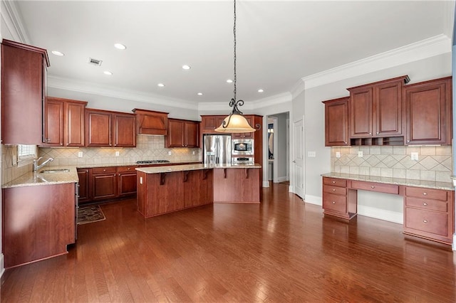 4677 Prater Way SE, Smyrna, GA 30080 - kitchen featuring appliances with stainless steel finishes, premium range hood, a center island, decorative backsplash, and a sink