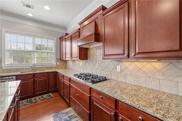 4677 Prater Way SE, Smyrna, GA 30080 - kitchen with a sink, appliances with stainless steel finishes, premium range hood, wood finished floors, and ornamental molding