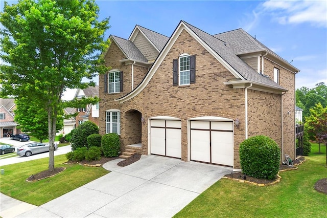 4677 Prater Way SE, Smyrna, GA 30080 - traditional-style home featuring an attached garage, driveway, a front yard, and brick siding