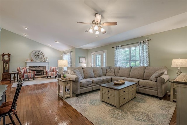 115 Oak Crest Ln, Dallas, GA 30132 - living room featuring a ceiling fan, light wood-type flooring, lofted ceiling, and a stone fireplace