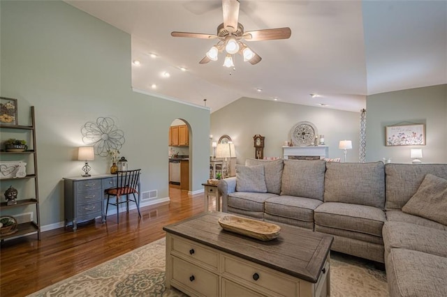115 Oak Crest Ln, Dallas, GA 30132 - living room with vaulted ceiling, arched walkways, light wood-style floors, a ceiling fan, and baseboards