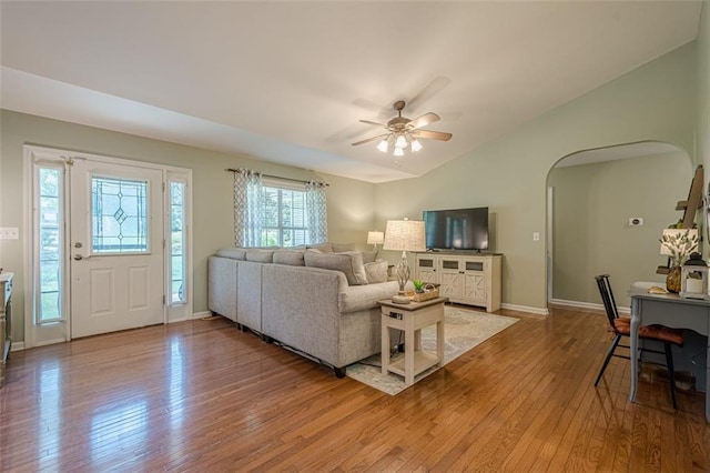 115 Oak Crest Ln, Dallas, GA 30132 - living room with lofted ceiling, arched walkways, wood-type flooring, a ceiling fan, and baseboards
