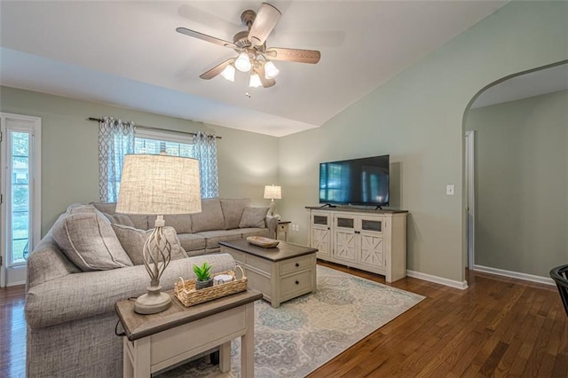 115 Oak Crest Ln, Dallas, GA 30132 - living area with dark wood finished floors, arched walkways, vaulted ceiling, a ceiling fan, and baseboards