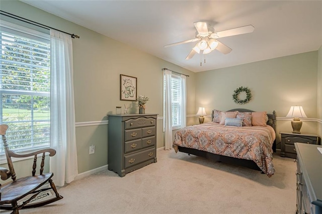 115 Oak Crest Ln, Dallas, GA 30132 - bedroom with light colored carpet, multiple windows, a ceiling fan, and baseboards