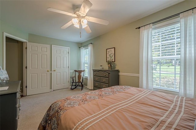 115 Oak Crest Ln, Dallas, GA 30132 - bedroom with light carpet, ceiling fan, and a closet