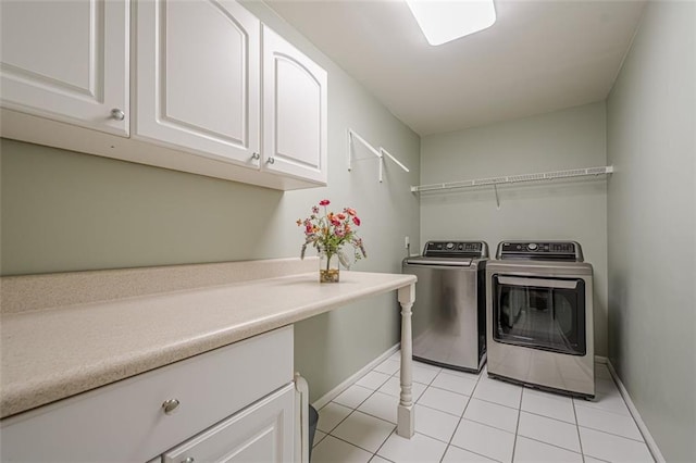 115 Oak Crest Ln, Dallas, GA 30132 - laundry area featuring washer and dryer, baseboards, cabinet space, and light tile patterned flooring