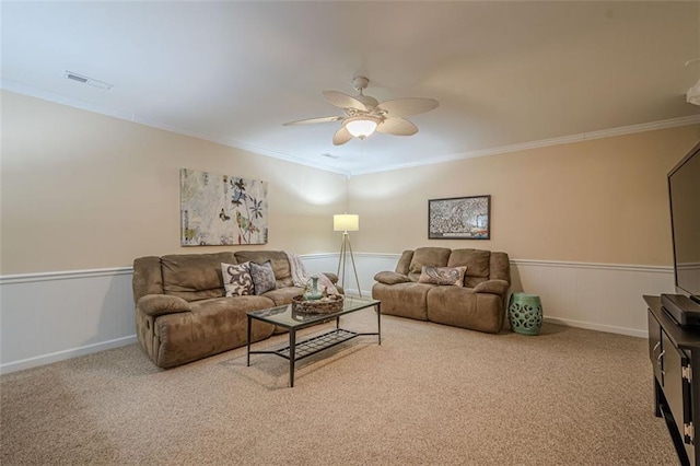 115 Oak Crest Ln, Dallas, GA 30132 - carpeted living room featuring ceiling fan, ornamental molding, and wainscoting