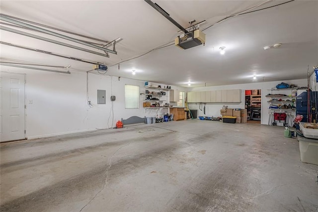 115 Oak Crest Ln, Dallas, GA 30132 - garage featuring a garage door opener and electric panel