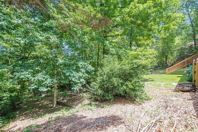 115 Oak Crest Ln, Dallas, GA 30132 - view of grassy yard with stairway and a fire pit