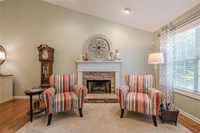 115 Oak Crest Ln, Dallas, GA 30132 - living area with a stone fireplace, baseboards, wood finished floors, and vaulted ceiling