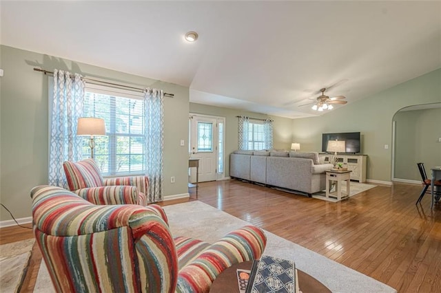115 Oak Crest Ln, Dallas, GA 30132 - living area featuring wood-type flooring, arched walkways, vaulted ceiling, a ceiling fan, and baseboards