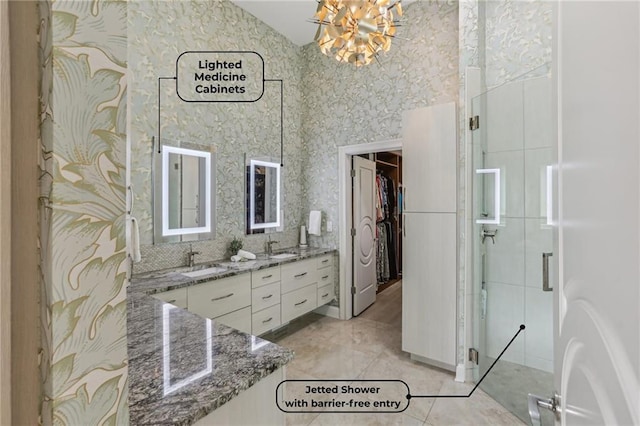 7540 Shadburn Ferry Rd, Cumming, GA 30041 - bathroom featuring double vanity, a chandelier, a high ceiling, a walk in closet, and a stall shower