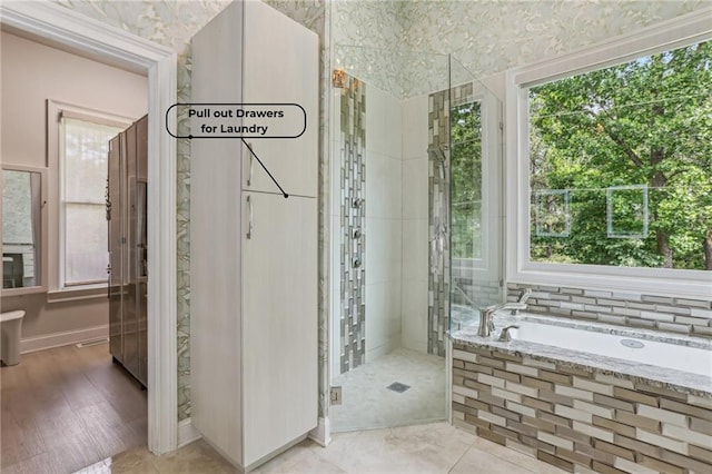 7540 Shadburn Ferry Rd, Cumming, GA 30041 - full bathroom featuring plenty of natural light, a garden tub, and a shower stall
