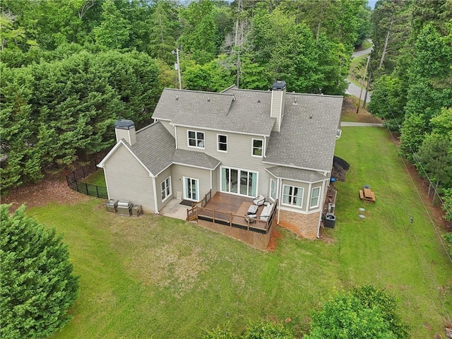 7540 Shadburn Ferry Rd, Cumming, GA 30041 - back of property featuring a chimney, a shingled roof, a deck, and central air condition unit
