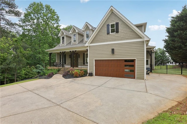 7540 Shadburn Ferry Rd, Cumming, GA 30041 - view of front of home with a porch, fence, driveway, and an attached garage
