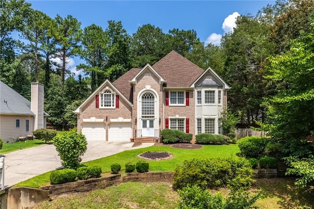 view of front facade featuring a garage and a front lawn