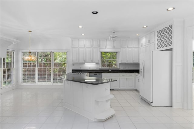 kitchen featuring light tile patterned floors, white fridge with ice dispenser, decorative light fixtures, stainless steel dishwasher, and white cabinetry