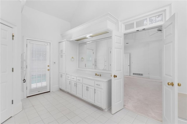 bathroom with tile patterned flooring and vanity